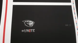 Press proof sheet with colour registration bars showing the Beavers logo and the #UN1TE campaign mark